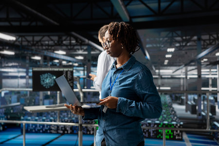 Server farm woman manager overseeing workers doing AI automatization, machine learning for servers infrastructure. Data center supervisor managing configurations with artificial intelligence.の写真素材