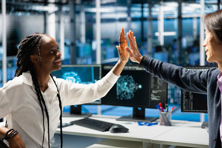 Data center technicians doing high five, happy after no issues detected while monitoring AI systems....