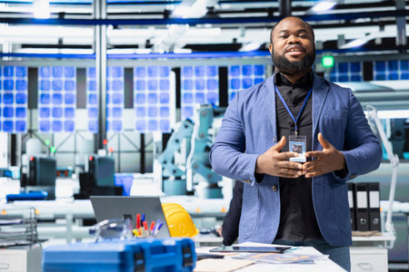 African american manager hosting a briefing meeting for solar panel production line, sharing ideas...