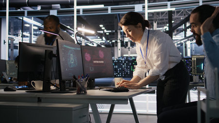 Panicked engineers in data center react to ransomware warning on PC display, scrambling to launch...