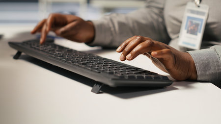 Close up of data center admin coding, writing script on PC identifying bottlenecks. Server farm IT expert typing on computer keyboard, troubleshooting bugs, implementing optimizations, camera Aの写真素材
