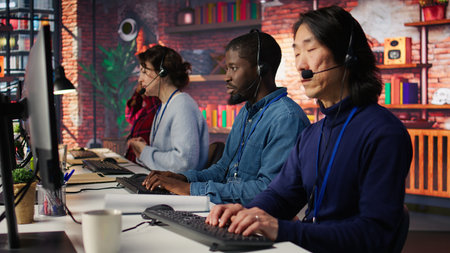 Call center agent helping customers regain access to accounts, diagnosing problems. Customer center staff member assisting clients needing help, providing accurate information, camera Bの写真素材