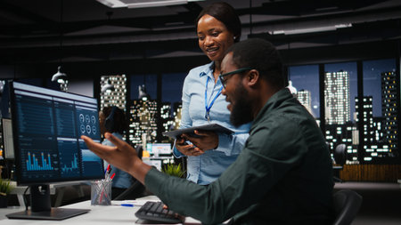African american coworkers doing high five after successful collaboration, working together for a...