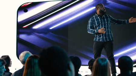 African american lead engineer revealing new smartphone launch with detailed presentation about new...