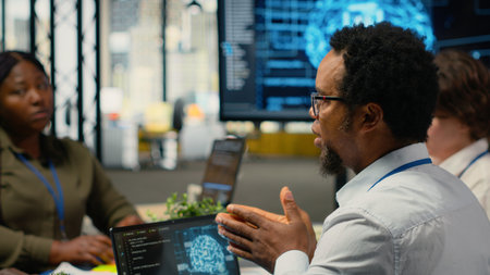 System administrators working in AI startup training predictive models for language processing...