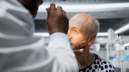 Medic in a clinical research procedure testing older patient with new pills, monitoring reactions and dosage outcome to ensure treatment safety and breakthrough discovery in medicine. Camera A.の写真素材