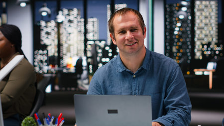Business manager in modern workplace sharing insights and reports, focusing on data visualization...