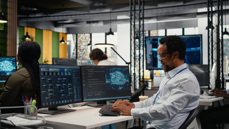 Engineer chatting with manager in office, laughing while automating workflows using AI. Supervisor...