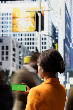 Horizontal isolated screen on smartphone near city crowd of different ages crossing together...