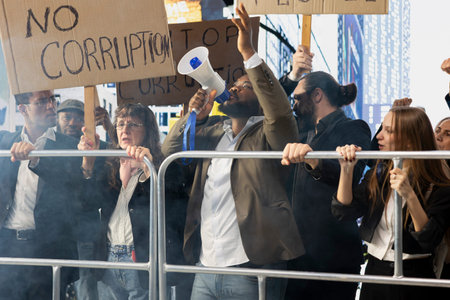 Protesters gather in rally against corrupted government and scandalous politics, holding cardboard...