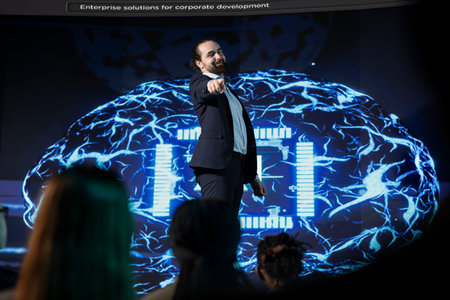 Charismatic public speaker gives artificial intelligence speech on stage, presenting new technology...