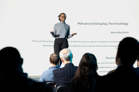 Product launch presentation with new phone interface and design. Young black woman lead engineer...