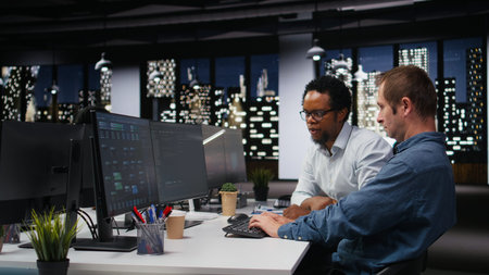 Engineering team in Silicon Valley company office developing apps with AI. Teamworking colleagues...