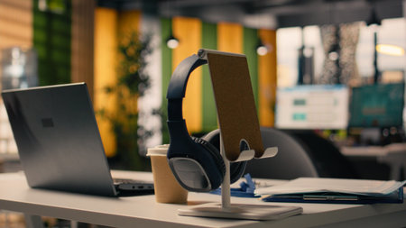 Empty corporate office space with office supplies and laptop at the setup, modern furniture and...