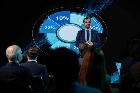 Male business expert hosting presentation and giving inspirational speech, highlighting networking...