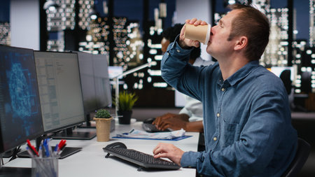 Tech startup worker drinking coffee, developing AI algorithms in high rise office. Caffeinated...