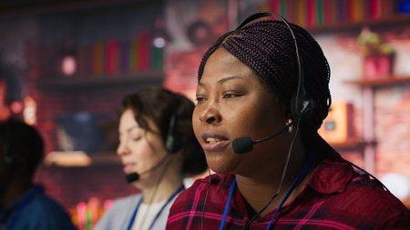 Call center staff member providing step by step guidance to customer. Customer center worker at...