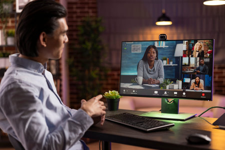 Male entrepreneur joins virtual discussion with multiethnic colleagues to plan marketing projects....