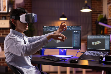 Remote worker wearing VR headset, designs mechanical prototypes using cad software. Creative...