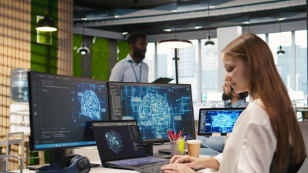 Female programmer in office integrating AI machine learning systems to streamline workflows. IT...