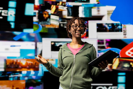 Smiling public speaking expert doing conference presentation in front of audience, showing clips on...
