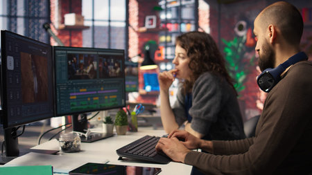 Video editors team working with AI chatbot and montage maker software, editing a background video...
