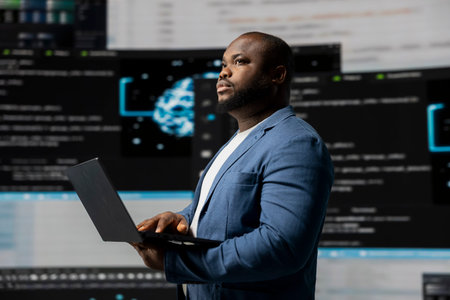 African american coder expert immersing in software development for a high tech work environment,...