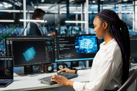 Computer scientist in high tech data center managing AI training datasets. African american woman...