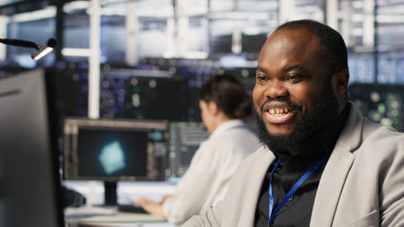 Data center system administrator monitoring servers gear performing AI training and inference tasks....