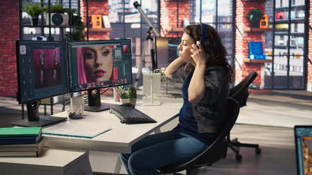 Digital media expert working on photo editing with professional software at creative agency,...