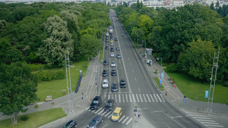 Exterior aerial landscape of modern town with busy streets, colorful cars and big park. Panoramic...