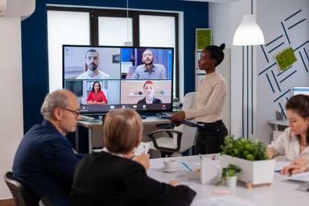 African woman discussing with remote managers on video call presenting new partners on webcam....