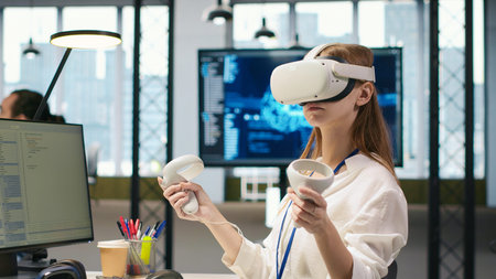 Female technician wearing VR goggles coding with AI language model assistance in startup office....