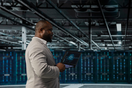 System administrator working in data center providing computing resources to enable AI training and...