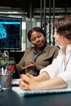 Engineering team in artificial intelligence startup office brainstorming, building scalable...