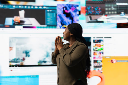 Woman mesmerized by immersive videowall, amazed by freedom of unlimited video content. User...