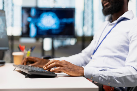 Close up of programmer typing on keyboard, utilizing AI to optimize performance and forecast issues....