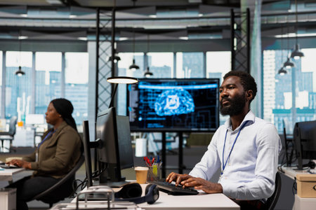 Software developer in office trains machine learning models for anomaly detection automation....