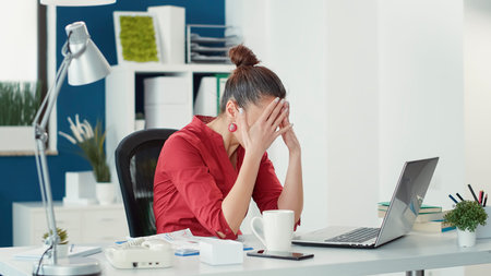 Stressed employee making mistake at office startup job, using sales statistics to do data research....