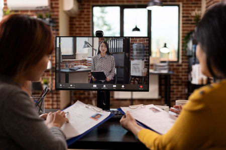 HR women representatives in a virtual meeting, exchanging notes about different job applicants....