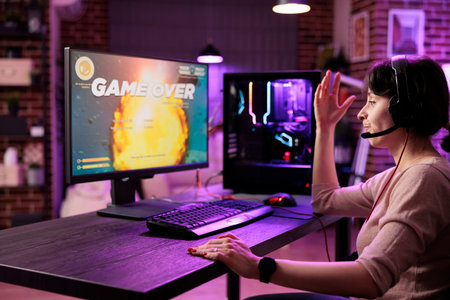 Frustrated gamer losing singleplayer spaceship arcade racing videogame, seeing game over screen on...