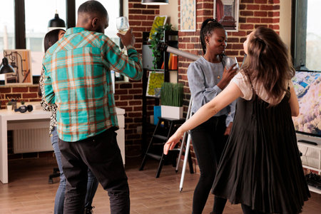 Culturally diverse couples of friends, mates gladly dancing, drinking wine, living together....