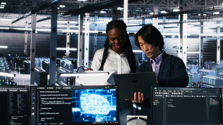 Data center engineers managing AI systems for uptime and efficiency, looking over paperwork files....
