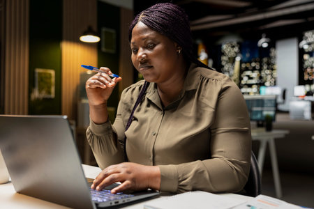 Focused businesswoman reflecting on a business strategy puzzle, envisioning creative concepts and projecting future outcomes. Deep contemplation to inspire a new perspective on the problem.の写真素材