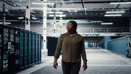 Portrait of smiling data center admin conducting security audit to protect against cyber threats....
