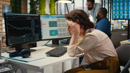 Frustrated businesswoman struggling with a stock crash downtrend, worrying and feeling stressed due...
