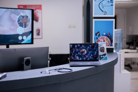 Coronavirus vaccination center showing illustrative images of covid 19 cell on laptop screen at...