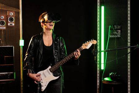 Guitarist with virtual reality headset enjoying rock concert simulation while playing heavy metal...