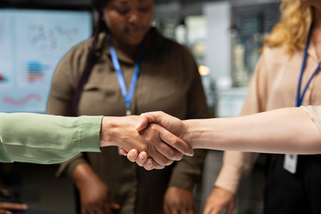 Close up of business managers doing handshake and welcoming each other, successful partnership to...