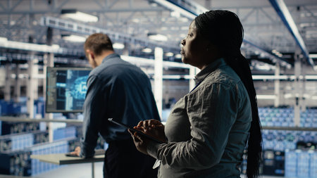 Teamworking data center programmers investigate neural networks configuration, making adjustments...